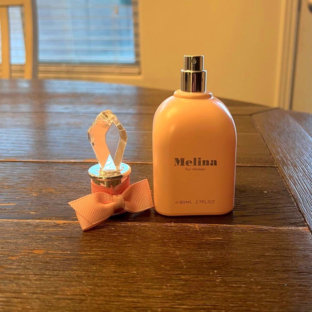 4 TJ Maxx Perfume Finds I Actually Own: Honest His & Hers Review Melina For Women perfume with the crystal cap off